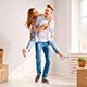 Comprar vivienda - Pareja joven mudandose a su nueva casa o vivienda sonriendo y felices Comprar vivienda - Pareja joven mudandose a su nueva casa o vivienda sonriendo y felices